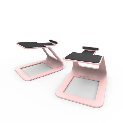 Pareja de soportes laterales Kanto SE2 rosa, vistos en ángulo frontal, con superficie antideslizante negra superior visible